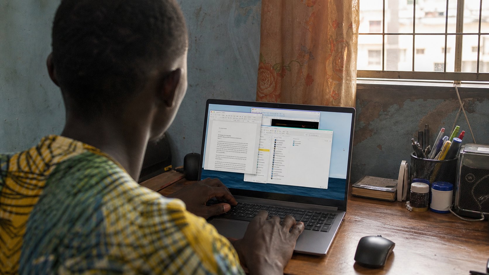 Overlapping windows on a laptop, a learner choosing among them.