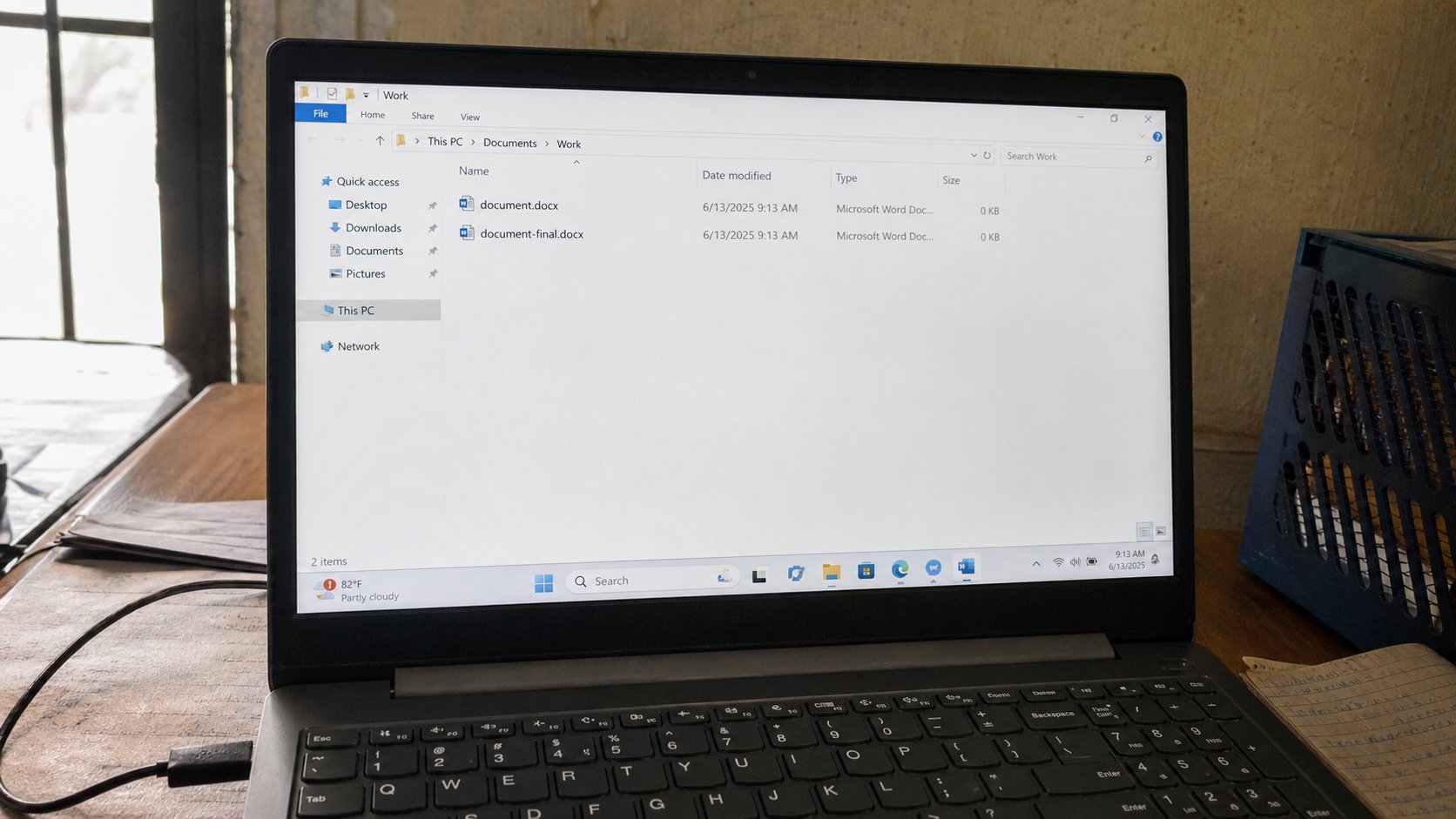 Two files with similar names on a laptop screen.